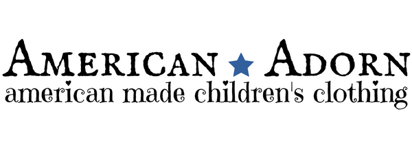 Logo of American Adorn, an American made children's clothing brand, with a blue star symbol.